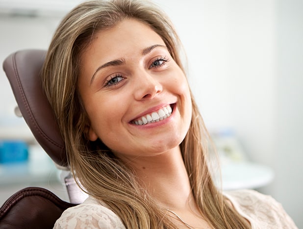 Woman smiling in the dental exam chair