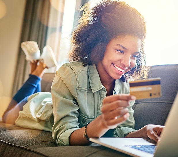 young woman smiling while shopping online