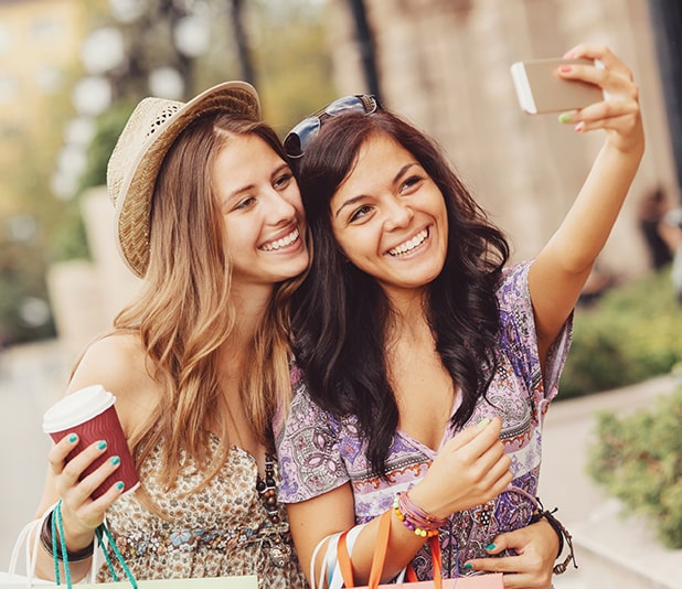 Two women smiling taking a selfie