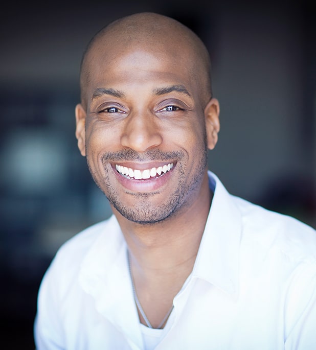 black man smiling with white teeth