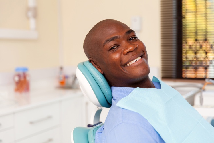 Bald man is relaxed in a dental chair at Hillstream Dental thanks to dental sedation