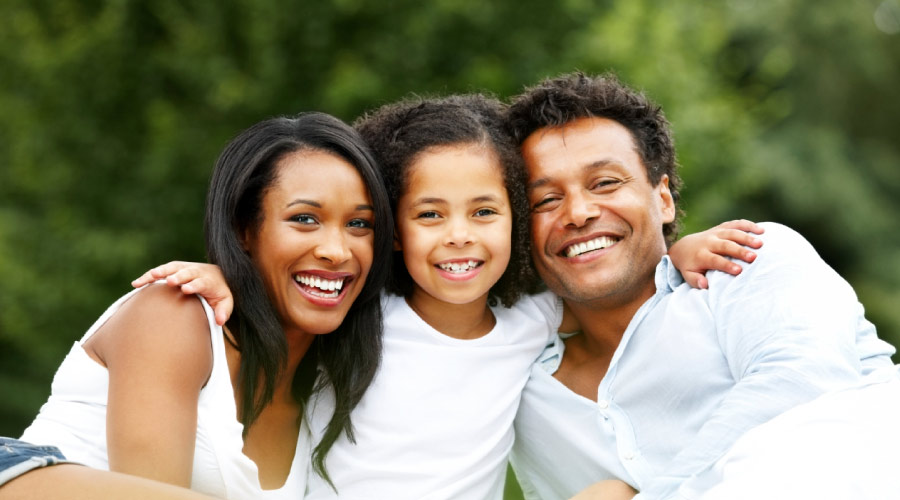 Smiling Black mom, daughter & dad