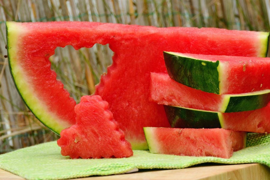Photo of a watermelon cut for eating.