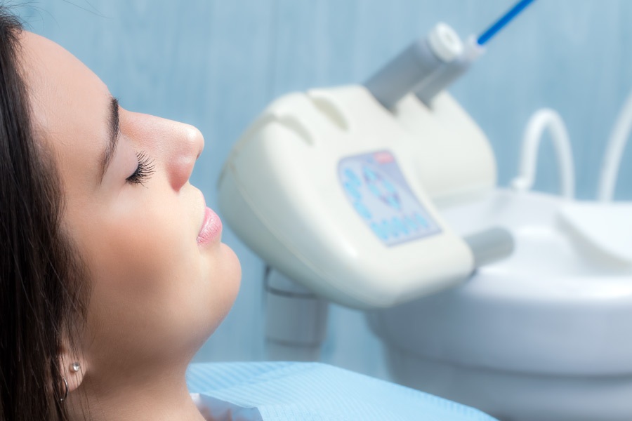 Woman relaxing in the dental chair after sedation.