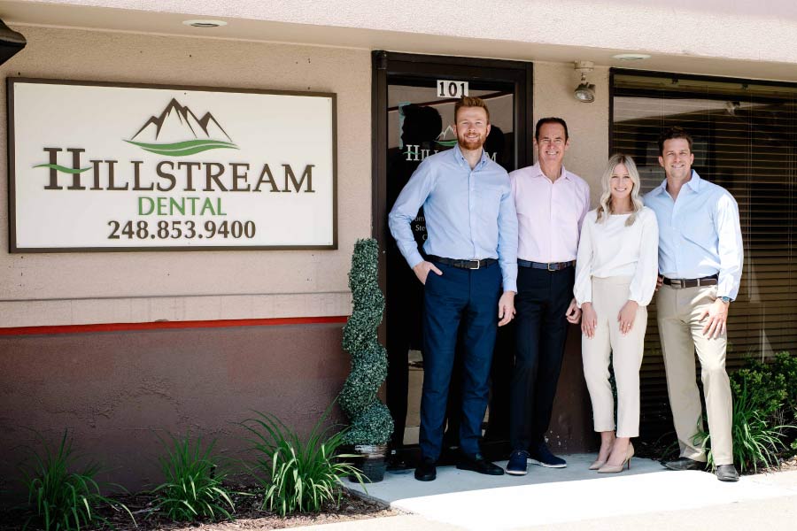Hillstream Dental doctors standing in front of the office.